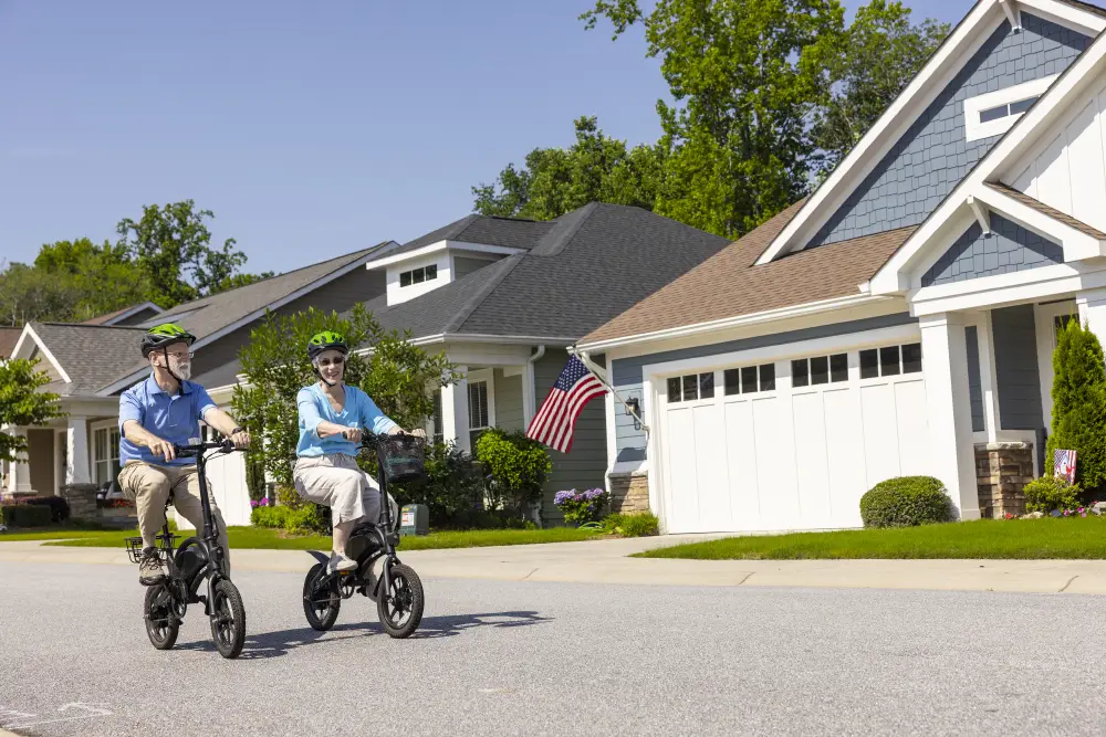 a senior couple riding their bikes at Rolling Green Village